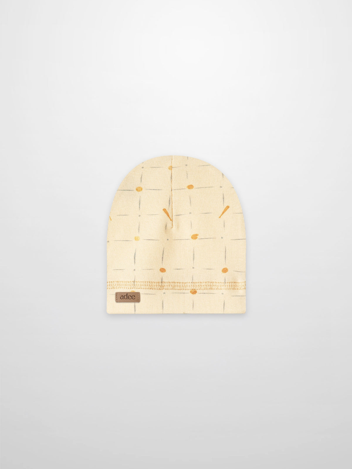 Grand Slam hat for boys by Adee; beige knit beanie with pale blue grid lines and orange dots.