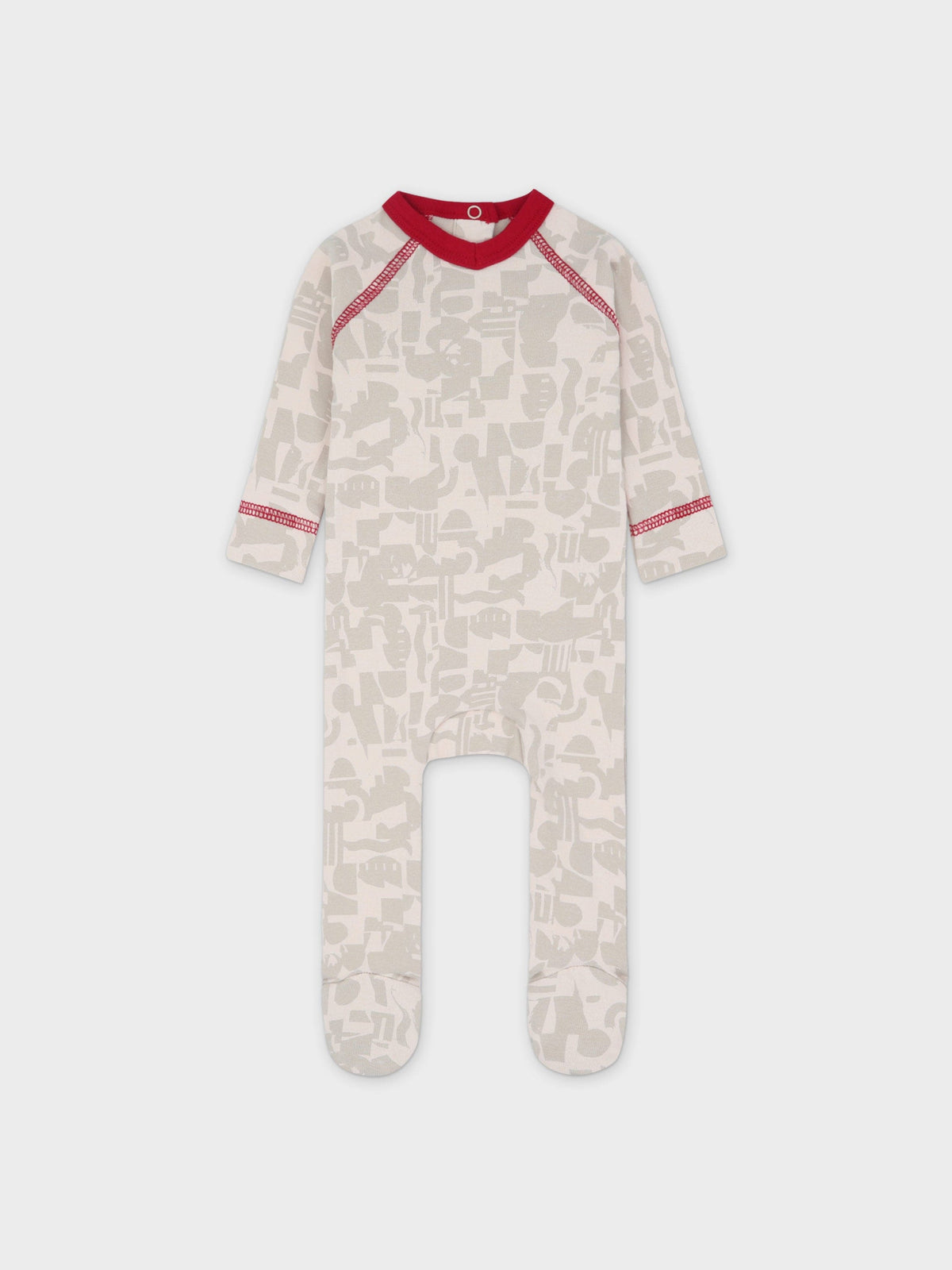 Abstract print stretchy red-trim baby girl footed jumpsuit with red stitching and a round neck
