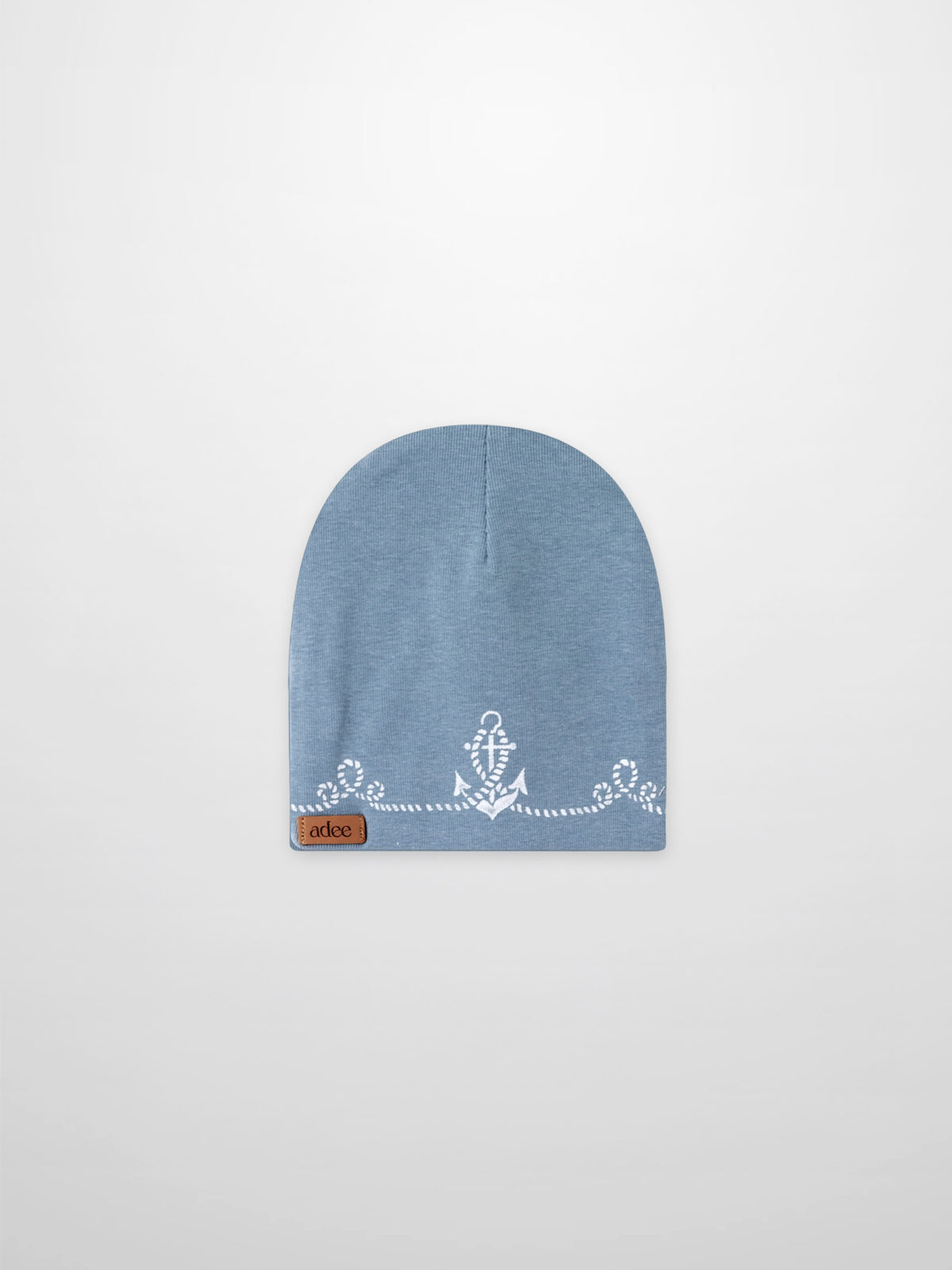 Blue Anchor Beanie for boys by Adee, a light blue knit hat with a white anchor motif and leather patch.