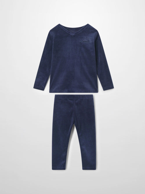 Navy ribbed velour two-piece pajama set for kids with a V-neck top and embroidered logo, matching pants.