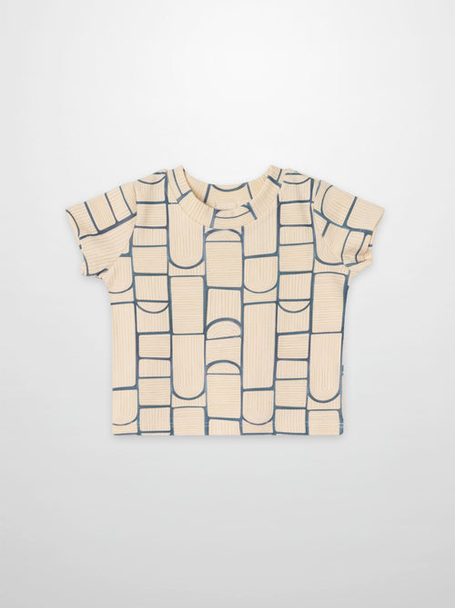 Abstract T-shirt for boys, short-sleeve, with a light beige base and navy blue geometric block pattern across the front.
