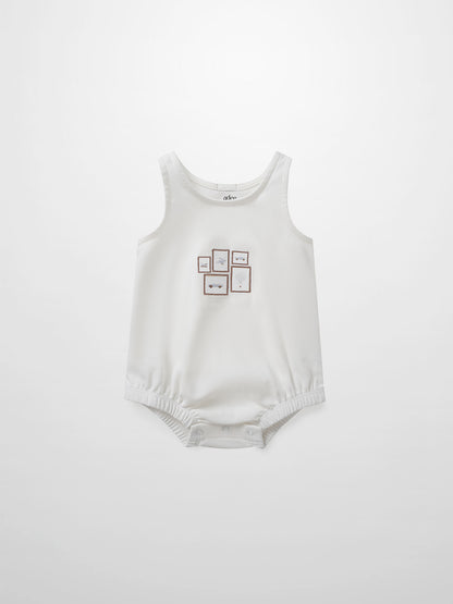 Mini Gallery Romper for baby boys by Adee in white with small framed artwork on the chest.