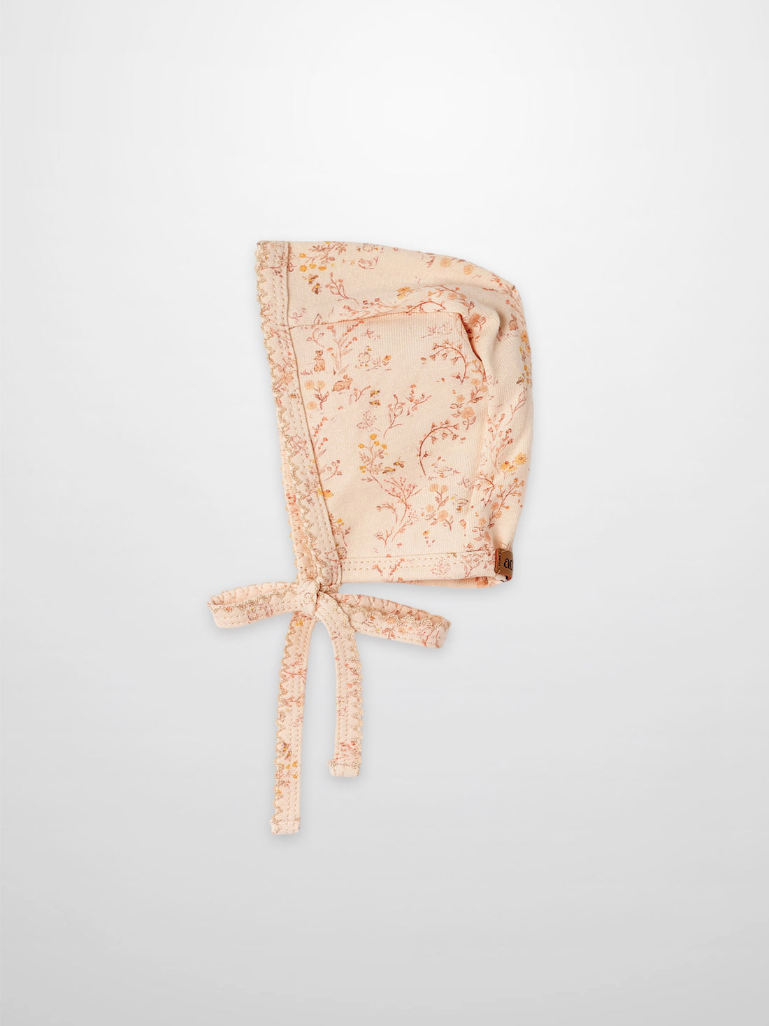 Sweet Meadow Bonnet for girls in peach floral print by Adee with lace trim and ties
