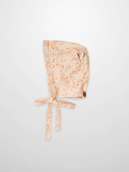 Sweet Meadow Bonnet for girls in peach floral print by Adee with lace trim and ties