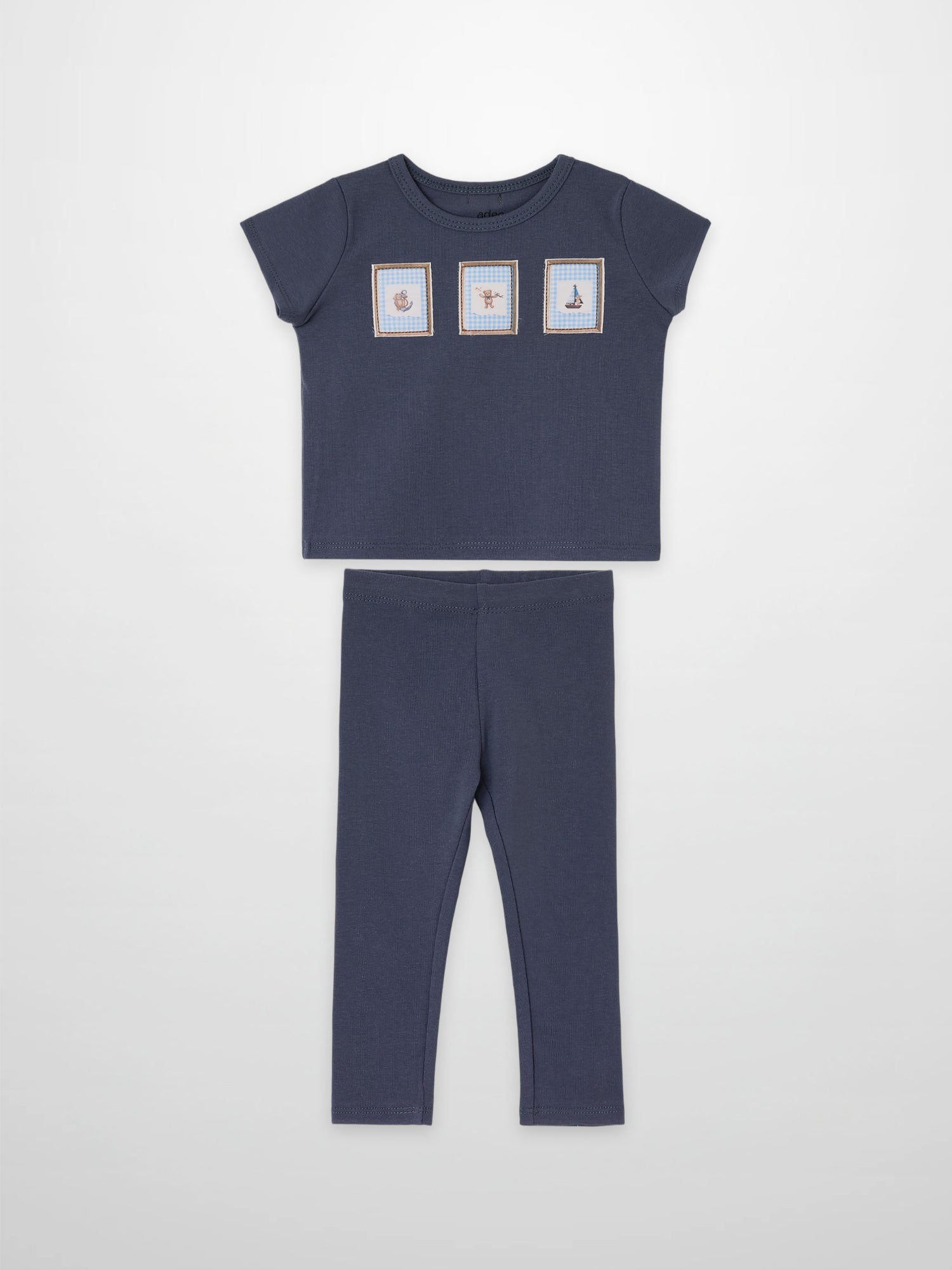 Teddy Frame Set by Adee; navy blue 2-piece little boys outfit with top featuring three framed prints and matching pants.