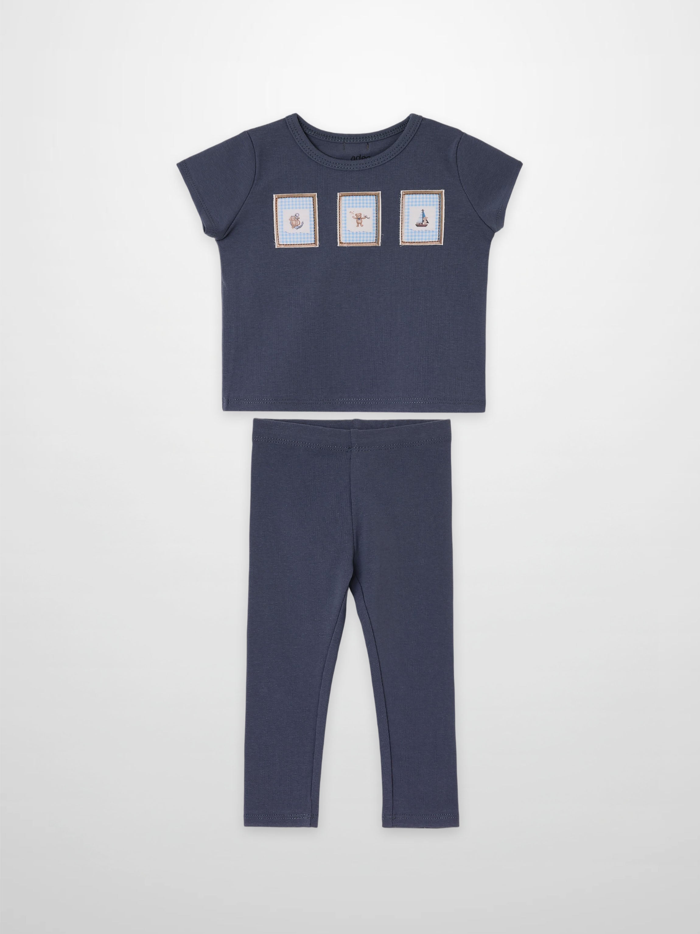 Teddy Frame Set by Adee; navy blue 2-piece little boys outfit with top featuring three framed prints and matching pants.