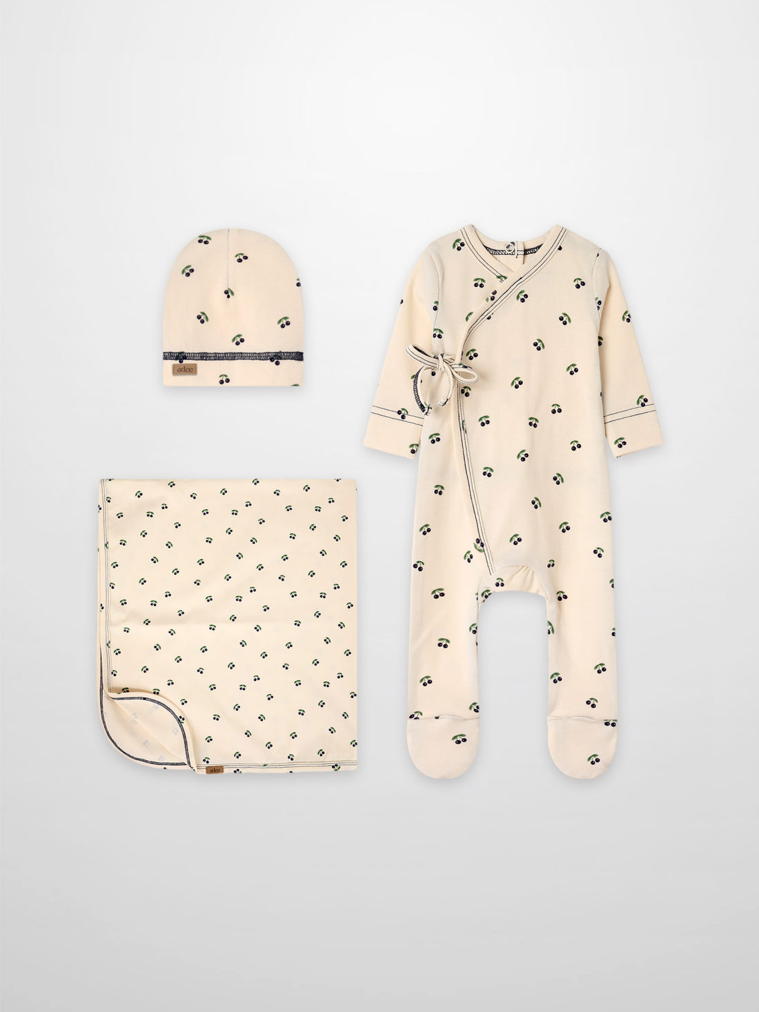 Adee Blue Cherry boys layette set cream cotton with small blue cherries; includes hat, blanket, and wrap robe.