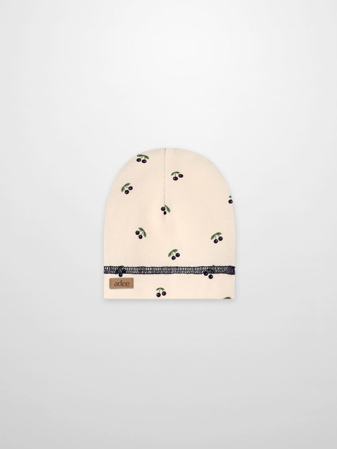 Blue cherry hat for boys by Adee, beige fabric with green leaves