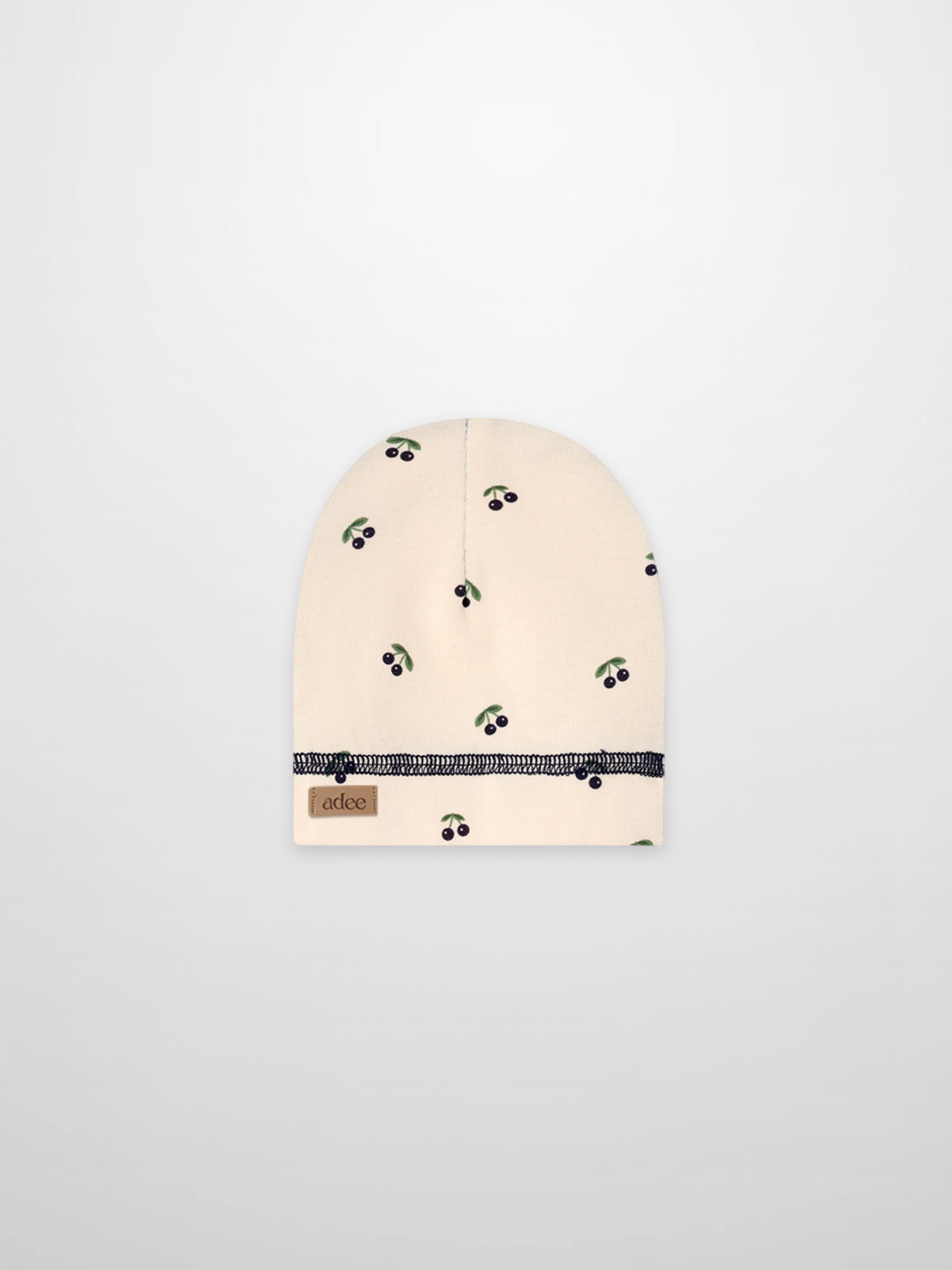 Blue cherry hat for boys by Adee, beige fabric with green leaves