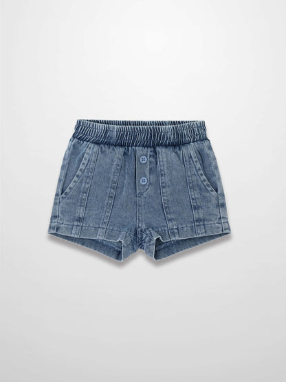 Paneled blue denim shorts with elastic waistband and button-front placket.