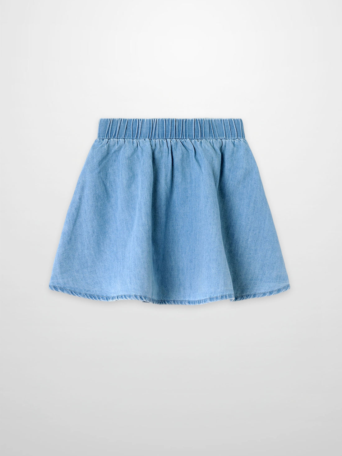 Circle skirt for girls in light denim with an elastic waistband.