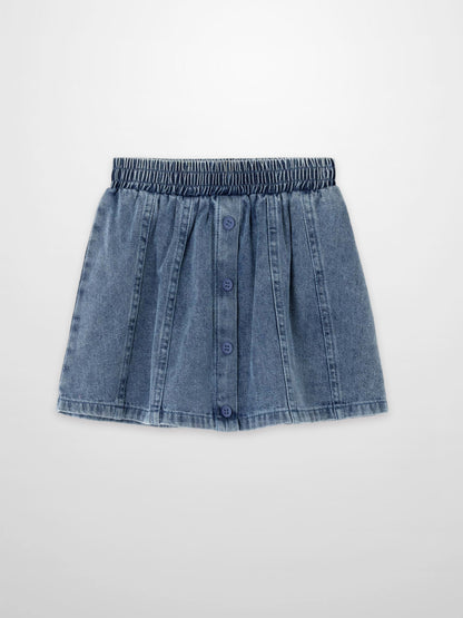 Paneled denim skirt for girls by Adee, blue denim with elastic smocked waistband and front buttons.