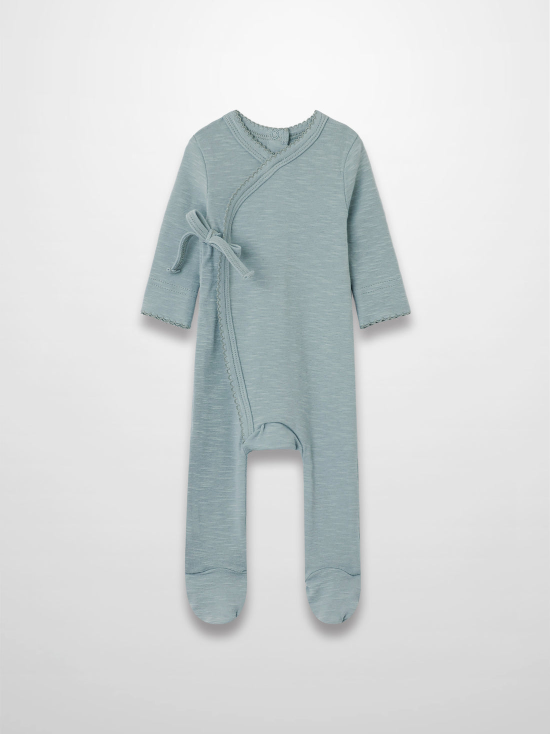 Blue scalloped stretchy baby jumpsuit footie with crossover wrap, scalloped trim, and side tie.