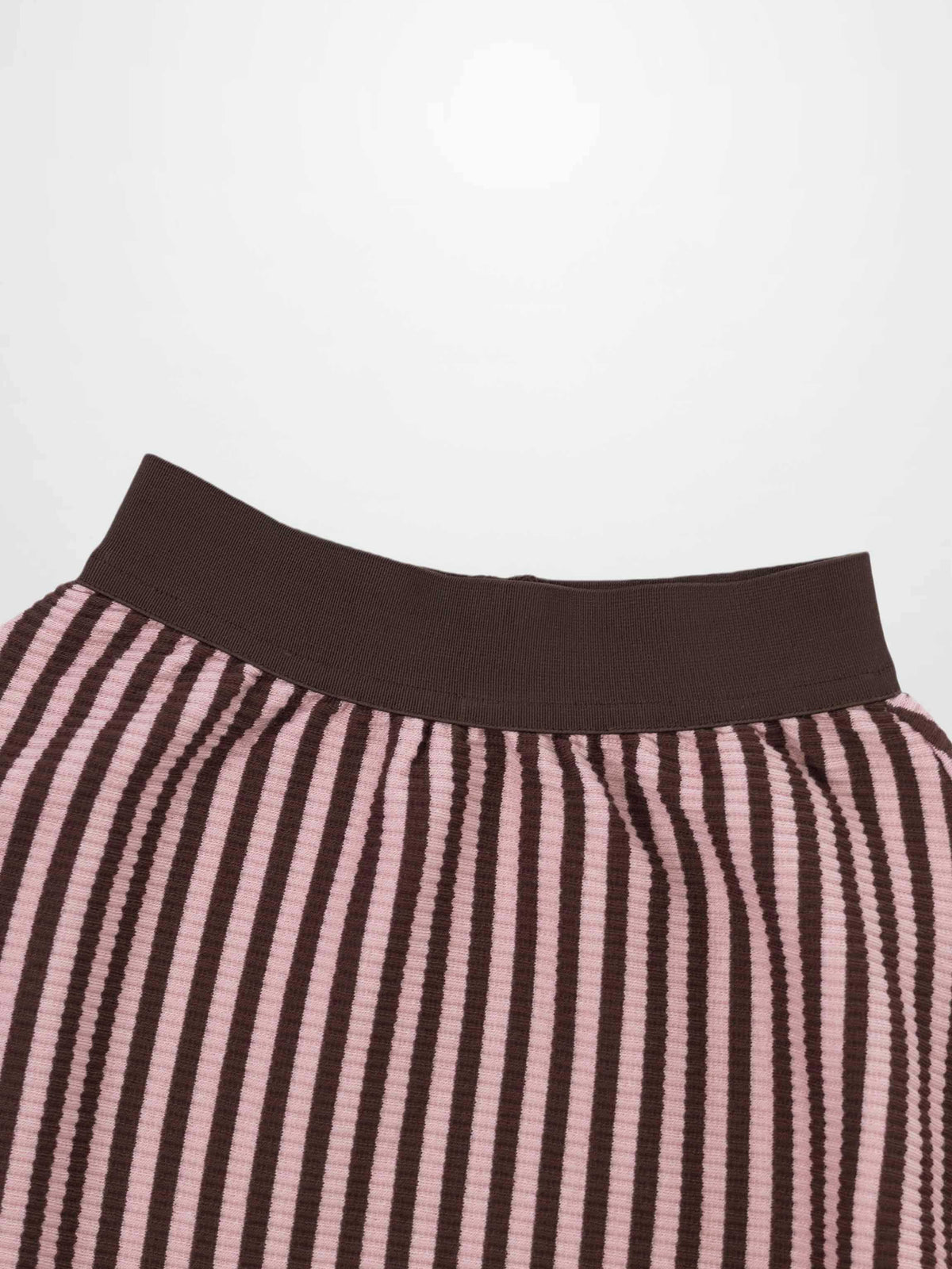 Striped skirt in brown and pink with a solid brown ribbed waistband.