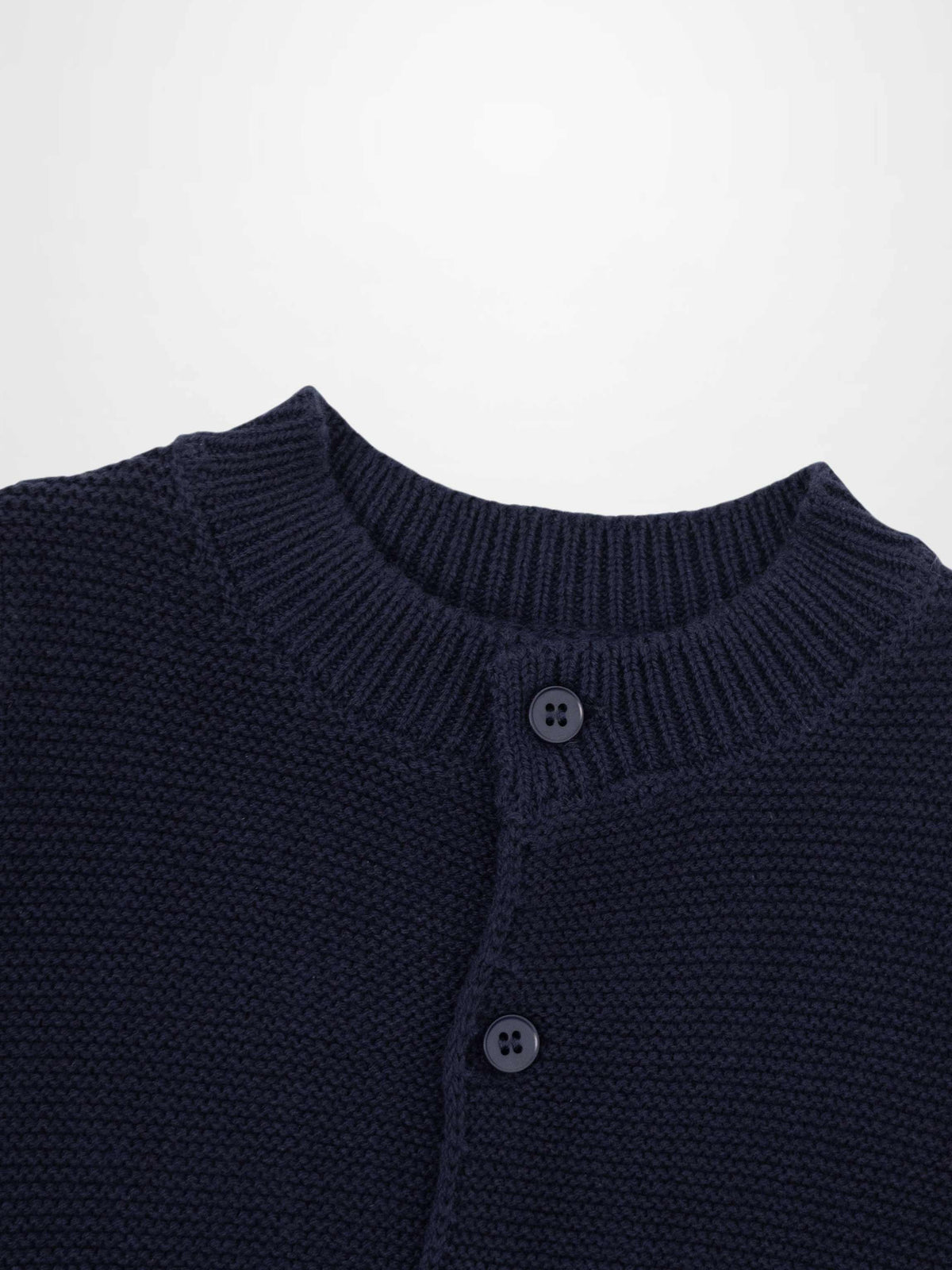 Knit cardigan in navy by Adee; unisex dressy top with chunky knit and two-button placket.