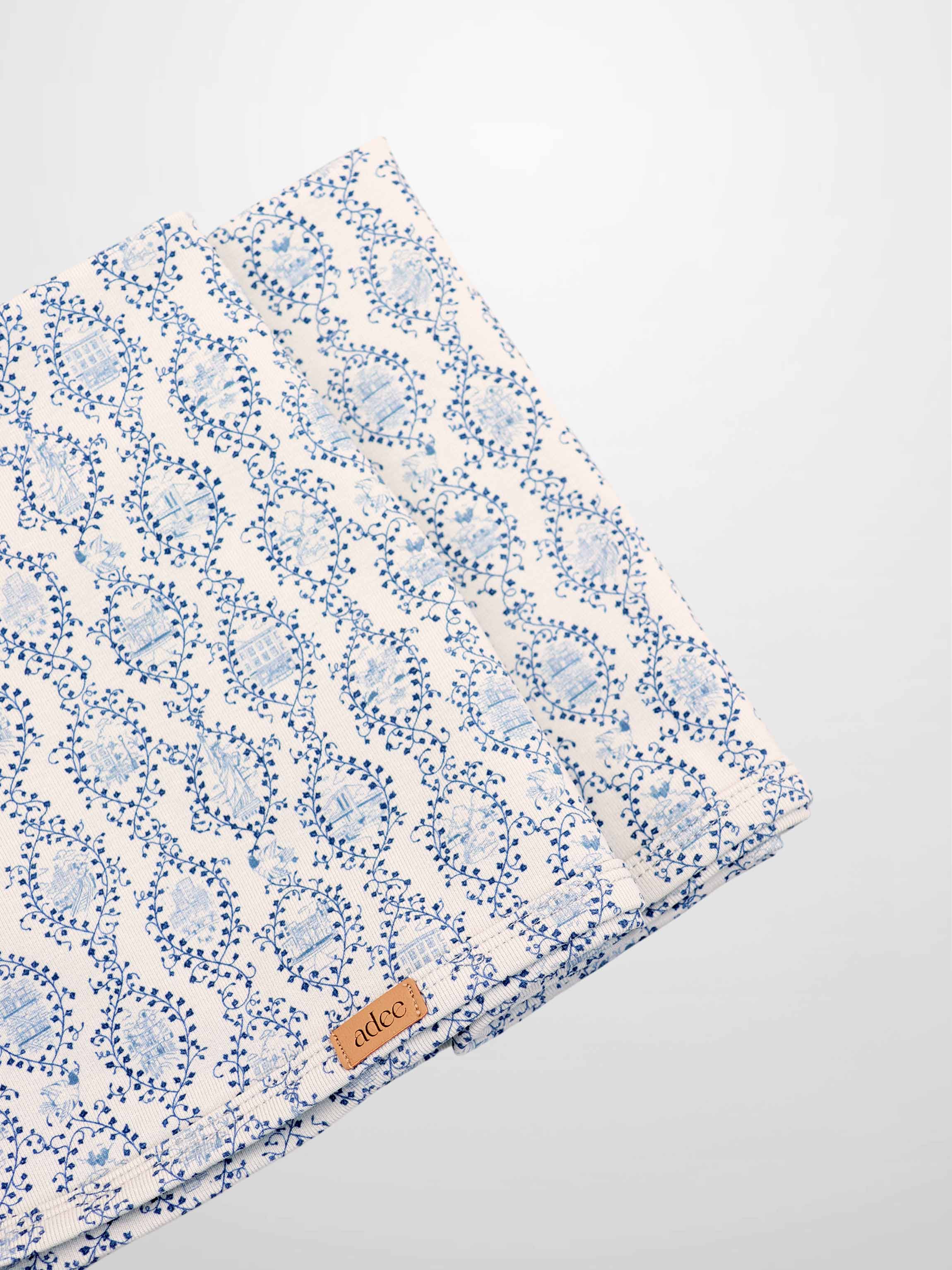 Blue Charm Blanket, a boys swaddle blanket by Adee with a dark blue vine pattern.
