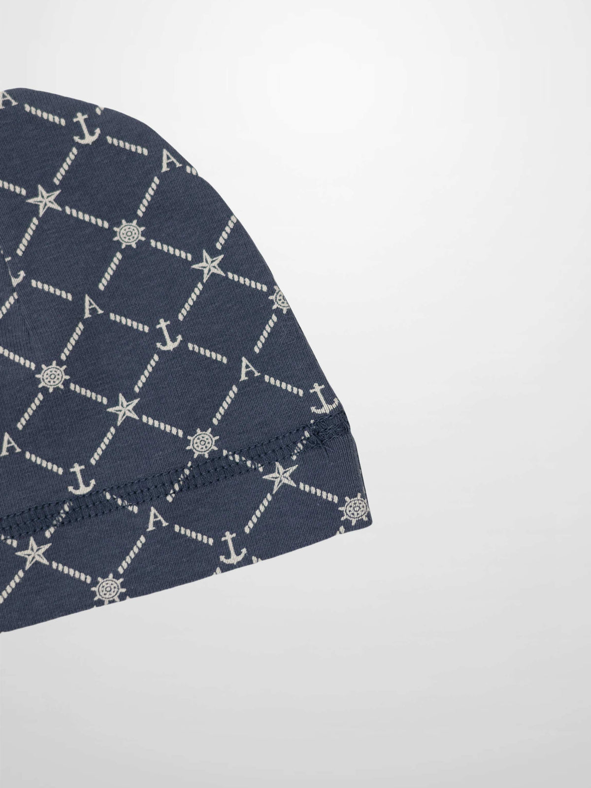 Crossover Anchor Beanie in navy with white rope diamond pattern, anchors, stars, ship wheels, and A for Adee