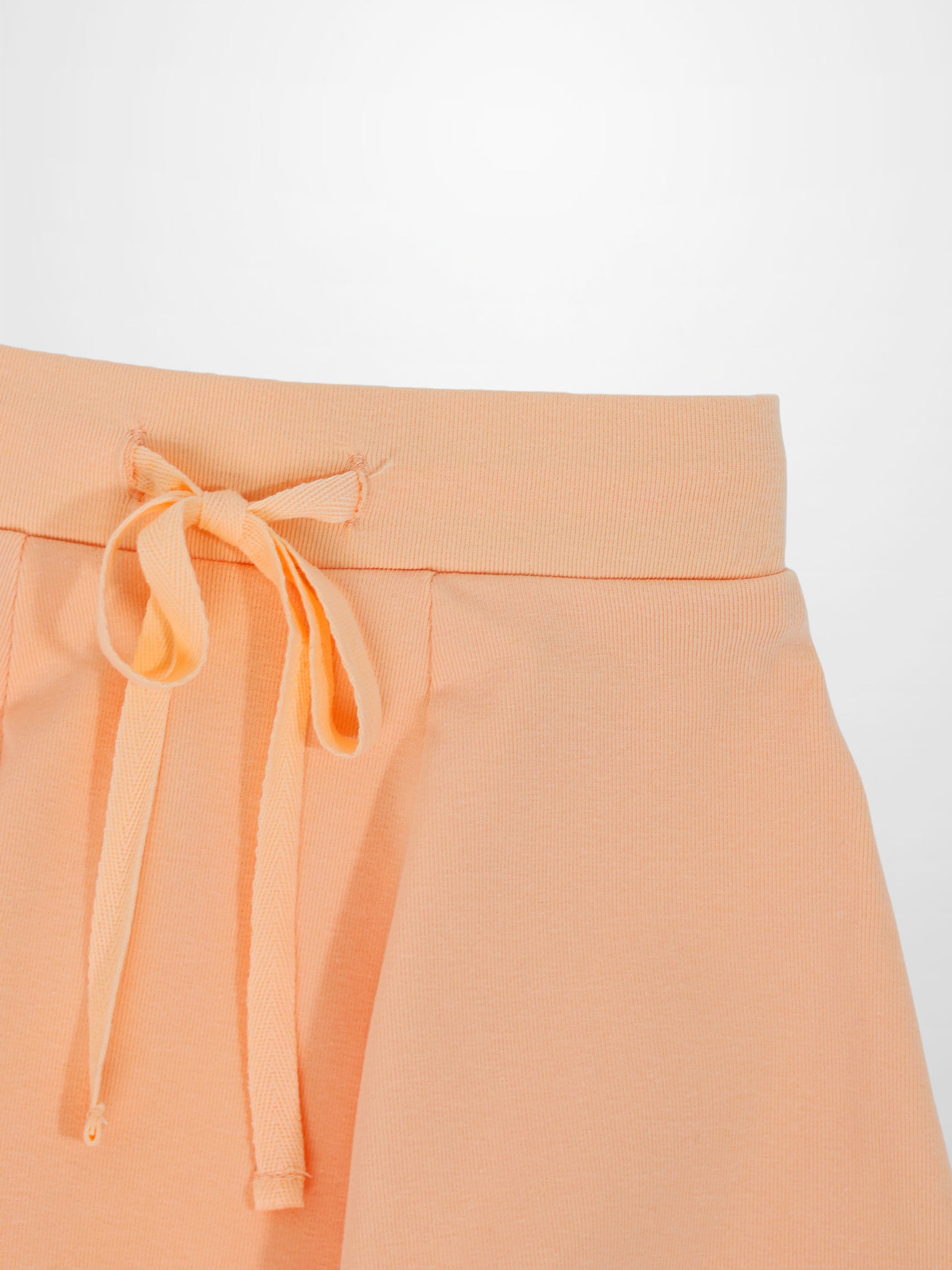 Peach 6-panel skirt with drawstring waist.