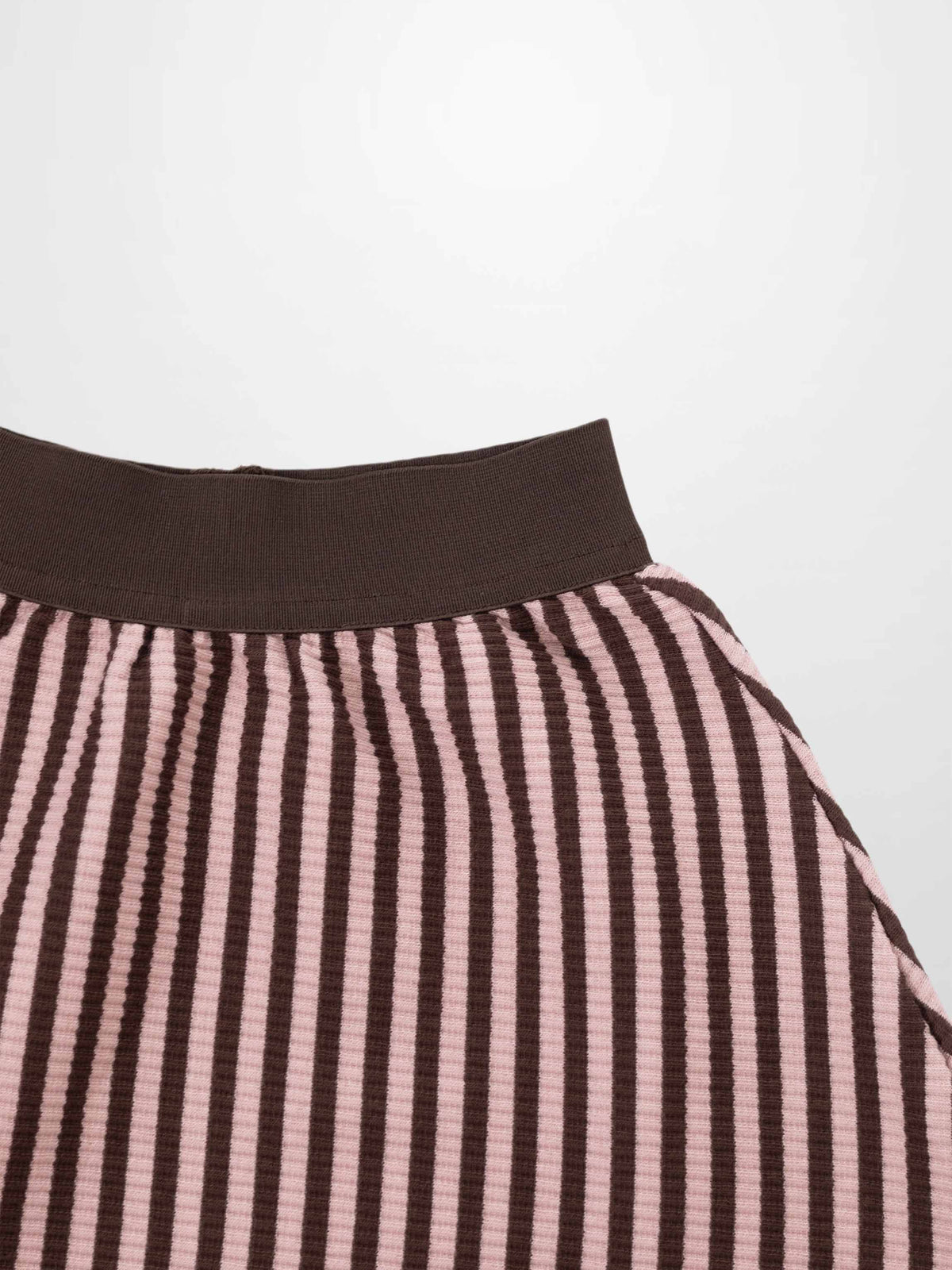 Brown and pink vertical striped knit skirt with a dark brown elastic waistband.