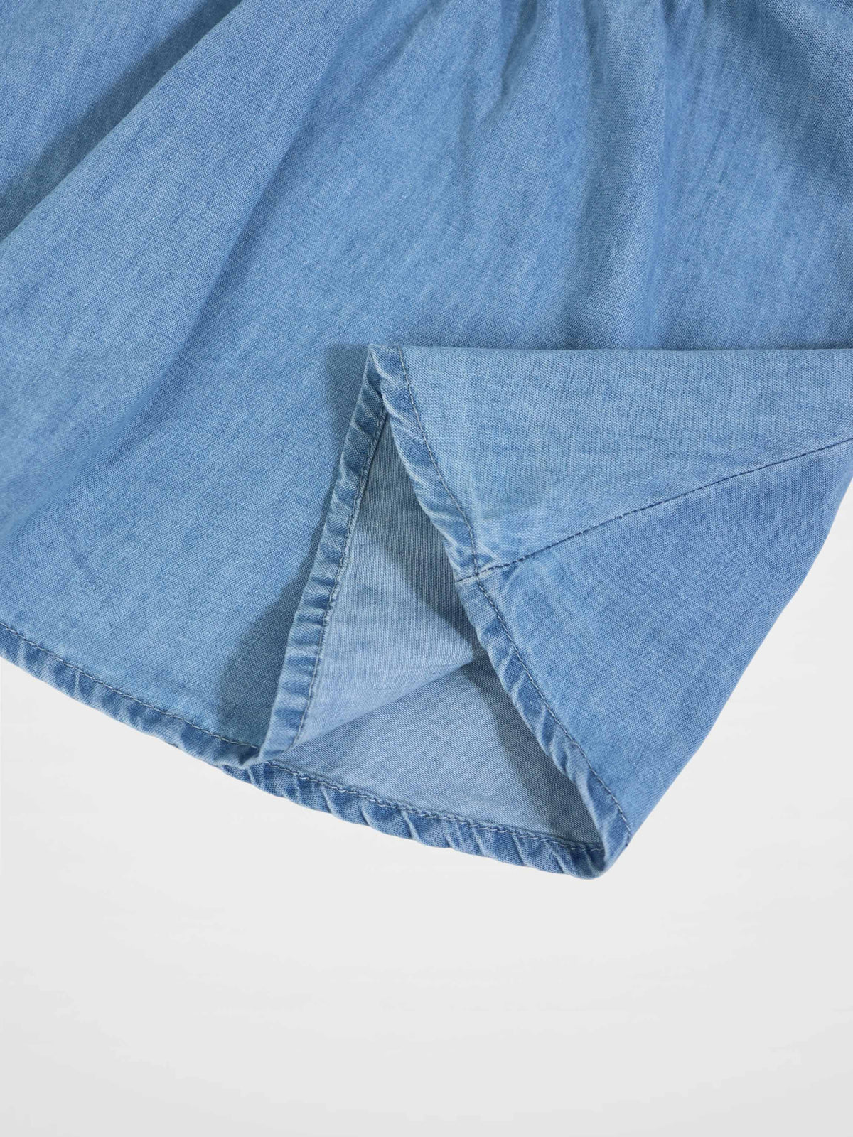 Circle Skirt for girls in light blue denim; soft, lightweight fabric with folded hem.