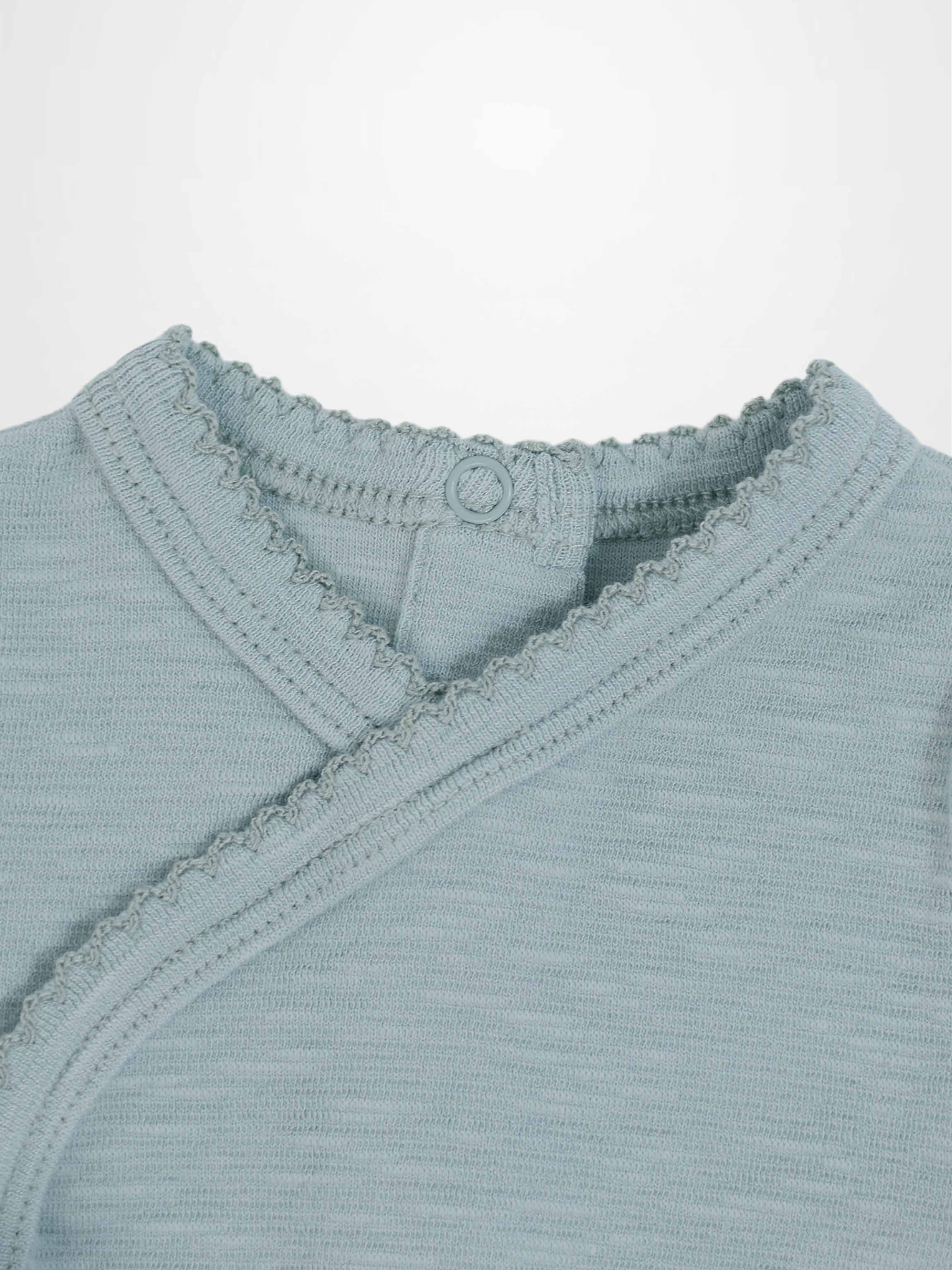 Blue Scalloped Stretchy boys top by Adee; knit fabric with scalloped trim and back-neck button.