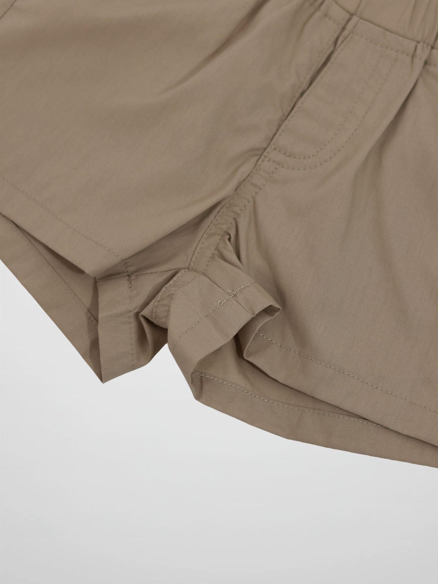 Adee tan cotton shorts for boys with rolled cuffs and an elastic waistband.