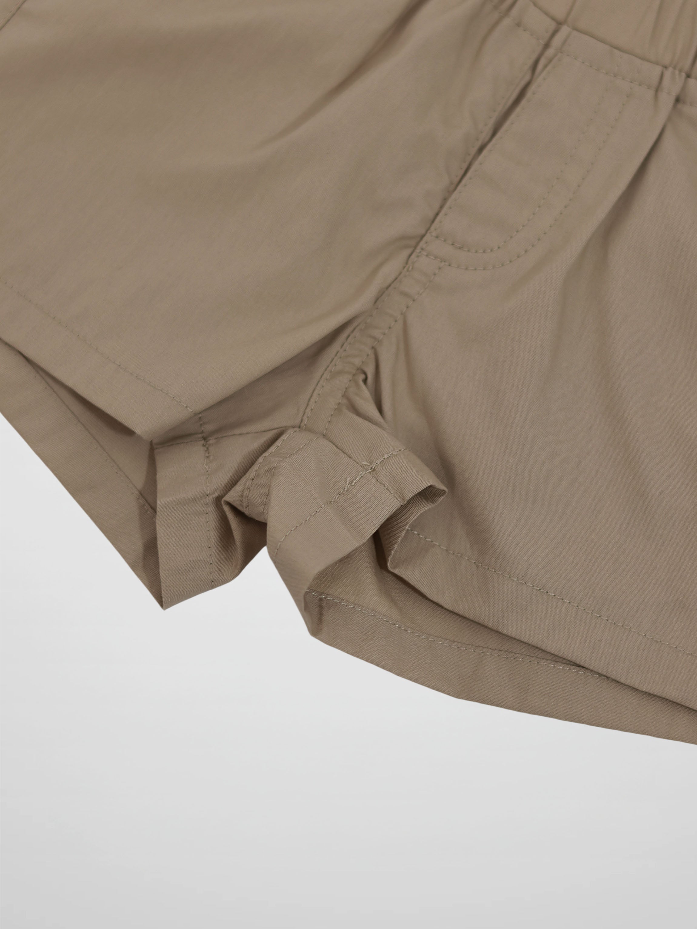 Adee tan cotton shorts for boys with rolled cuffs and an elastic waistband.