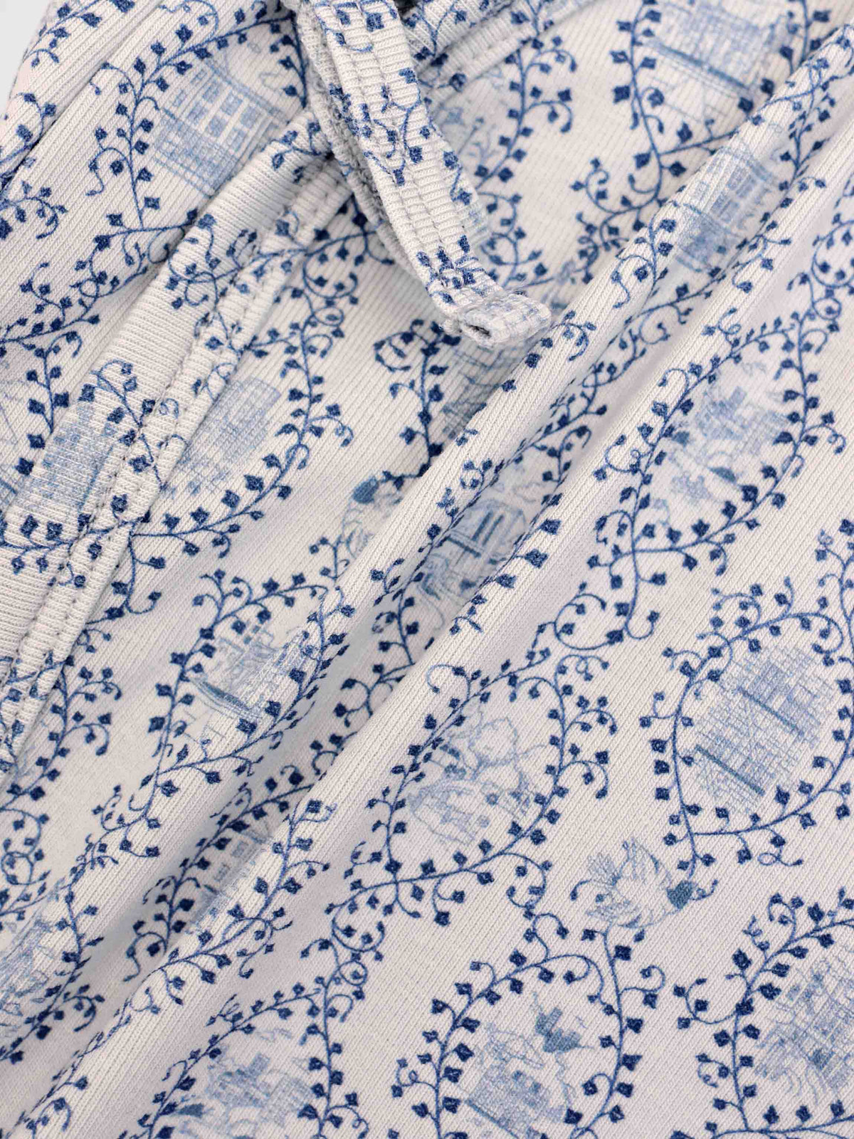 Blue Charm Bonnet; boys bonnet in white fabric with dark blue vine print