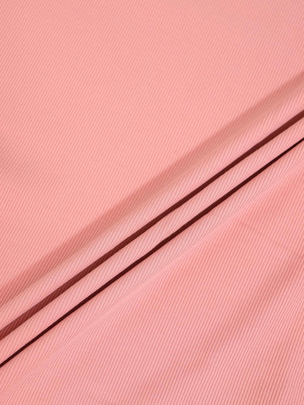 Thin ribbed beanie for girls in light pink; knit fabric close-up