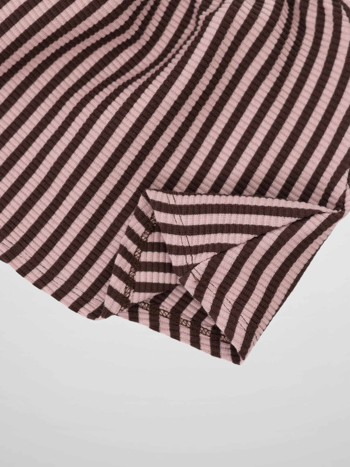 Striped brown and pink knit skirt with folded hem.