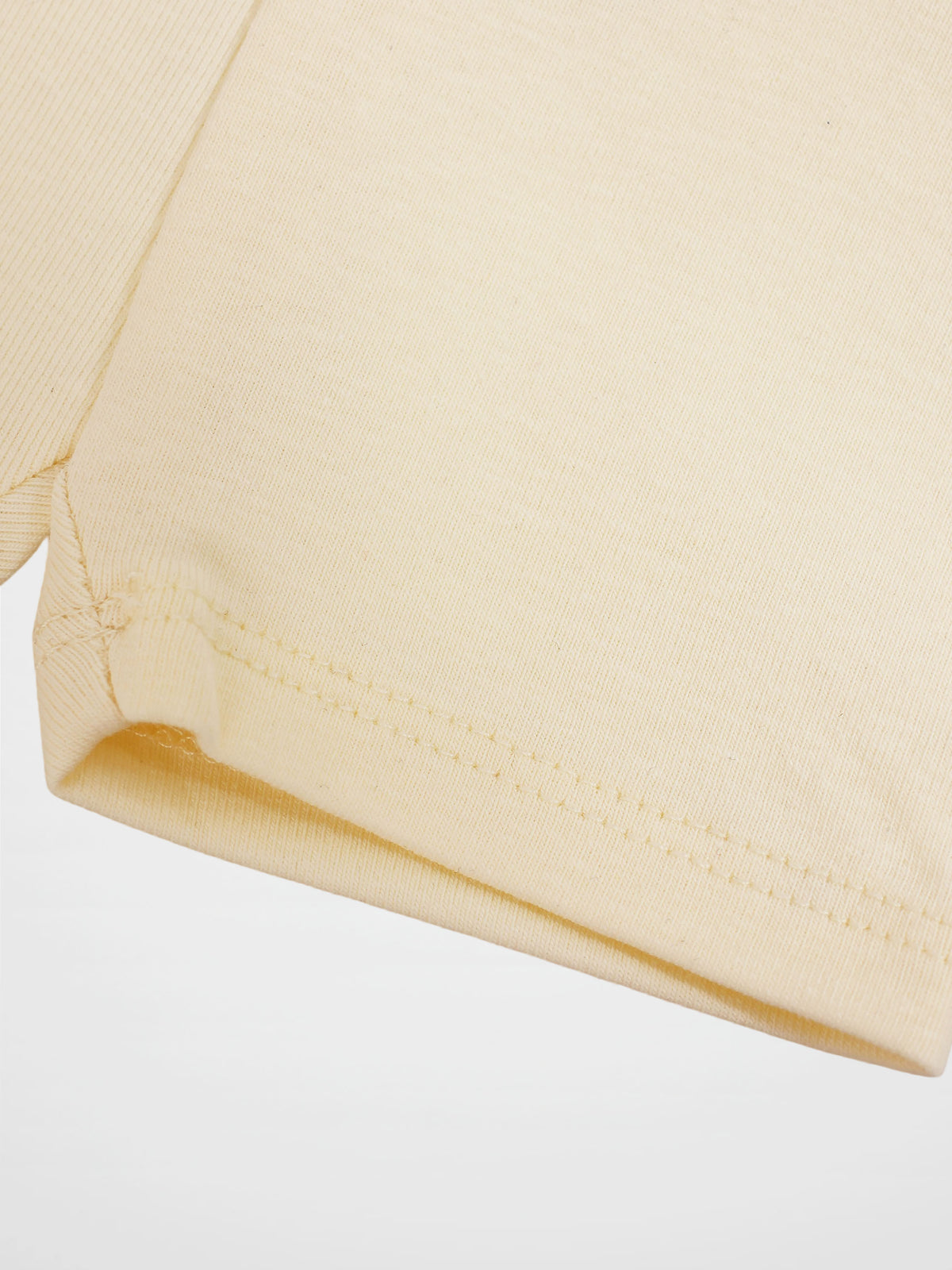 Biker shorts non ribbed off-white; beige knit fabric with visible hem stitching