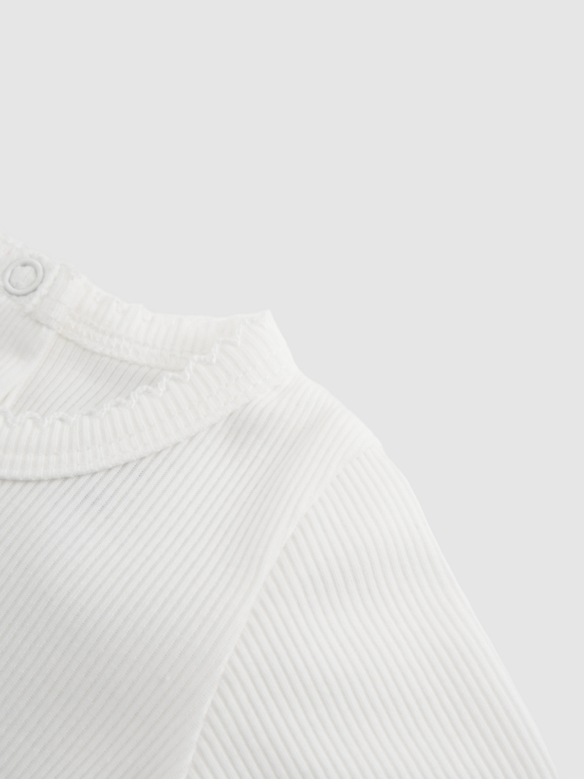 Girls Stretchies white ribbed knit top with lace trim at collar