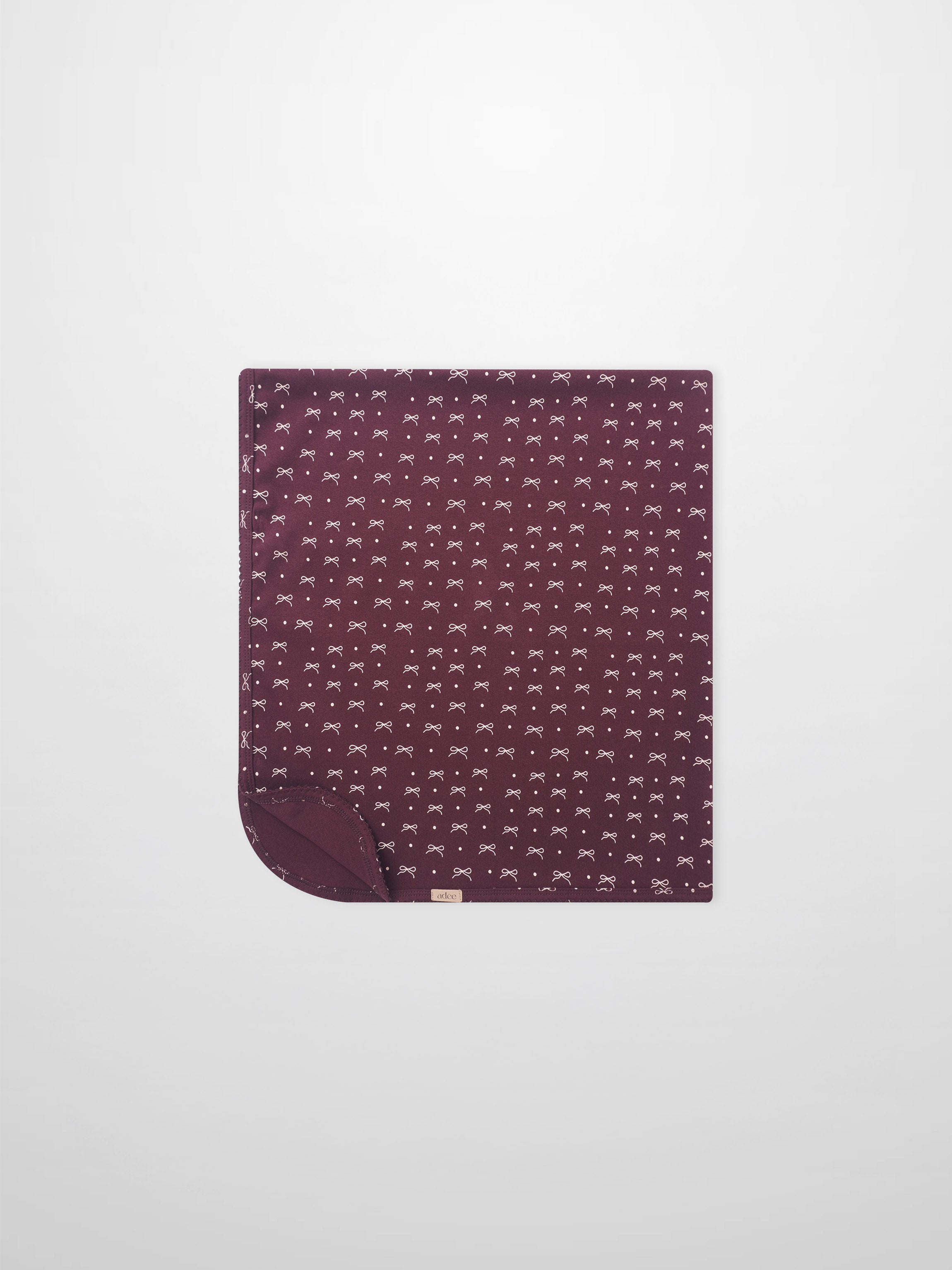 Burgundy Bow Blanket by Adee; girls swaddle blanket with white bow pattern