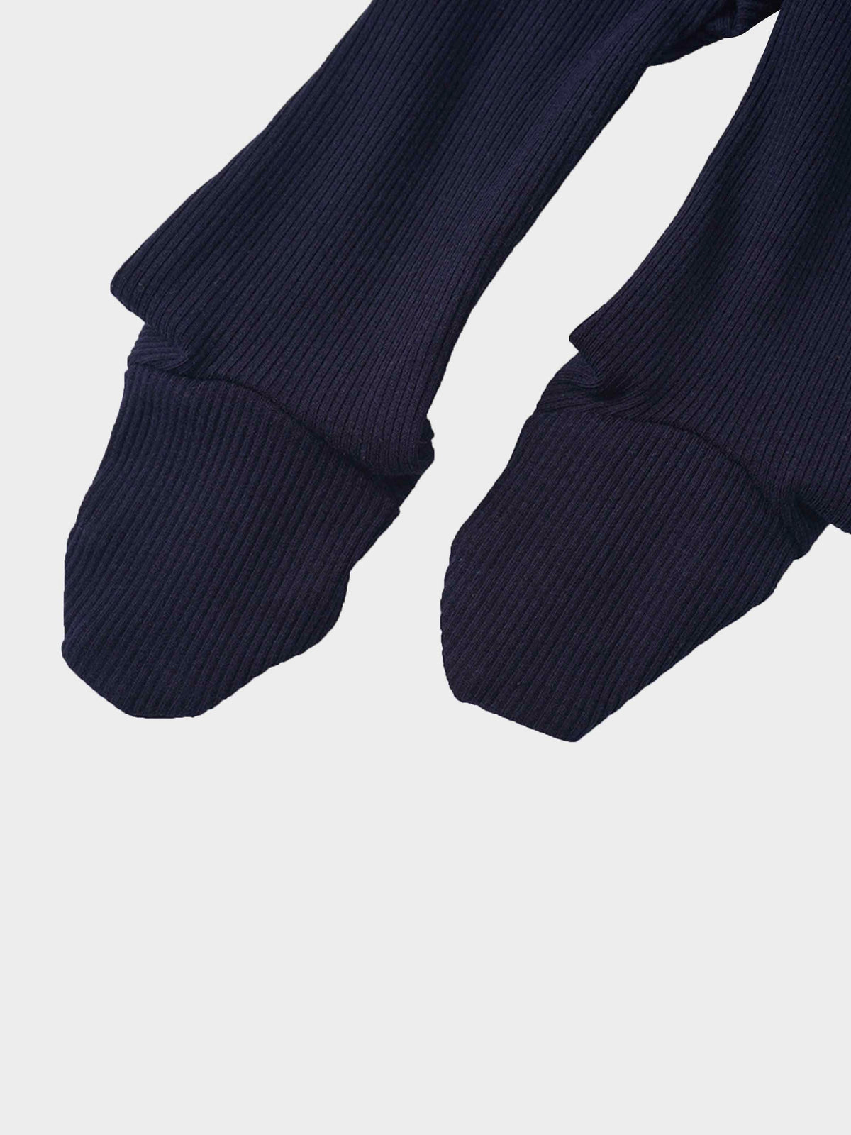 Navy ribbed knit baby footie with a mock neck and stretchy fabric.