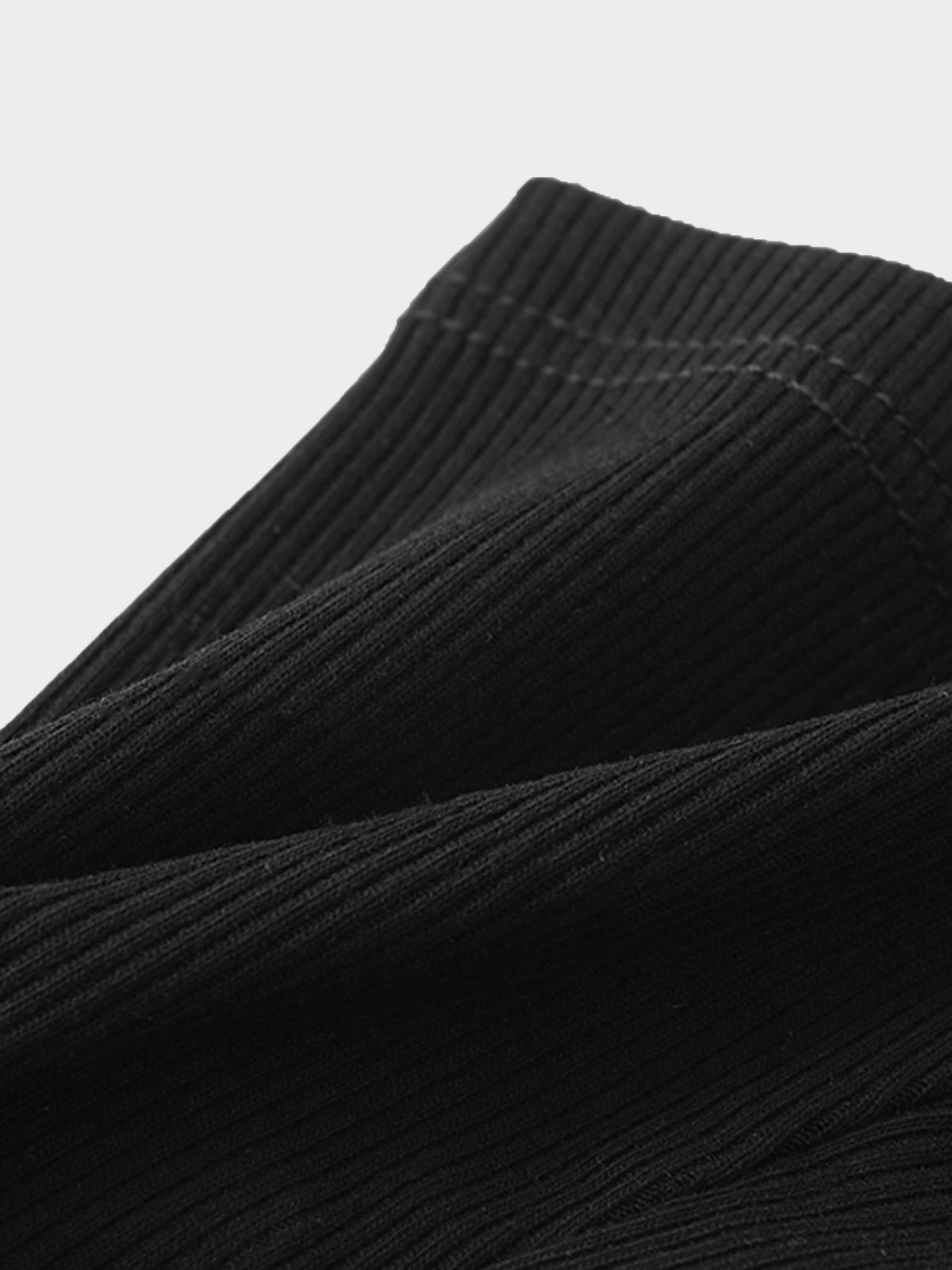 Biker shorts black thin ribbed knit fabric close-up