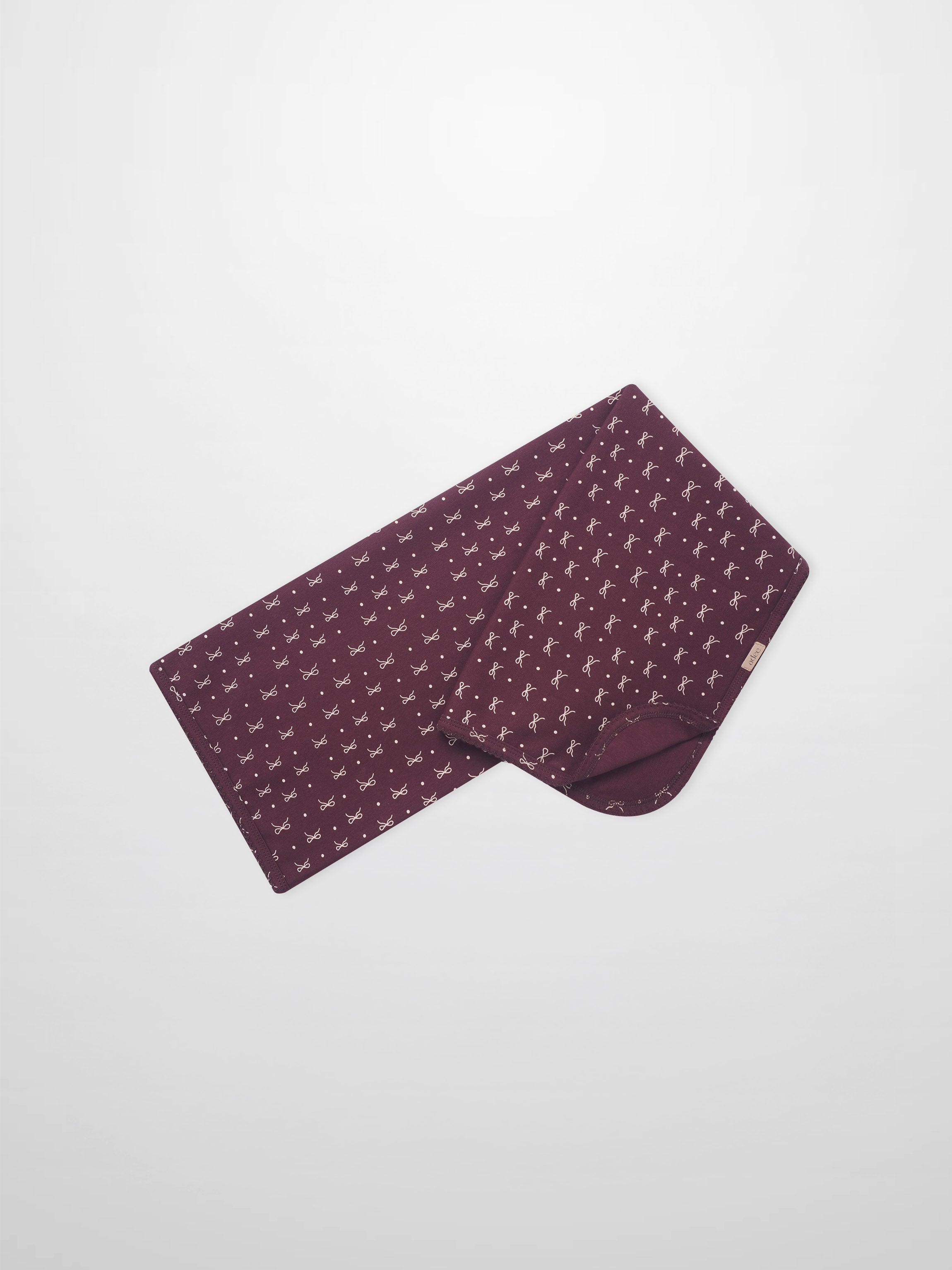 Adee Burgundy Bow Blanket swaddle for girls, burgundy with white bow pattern
