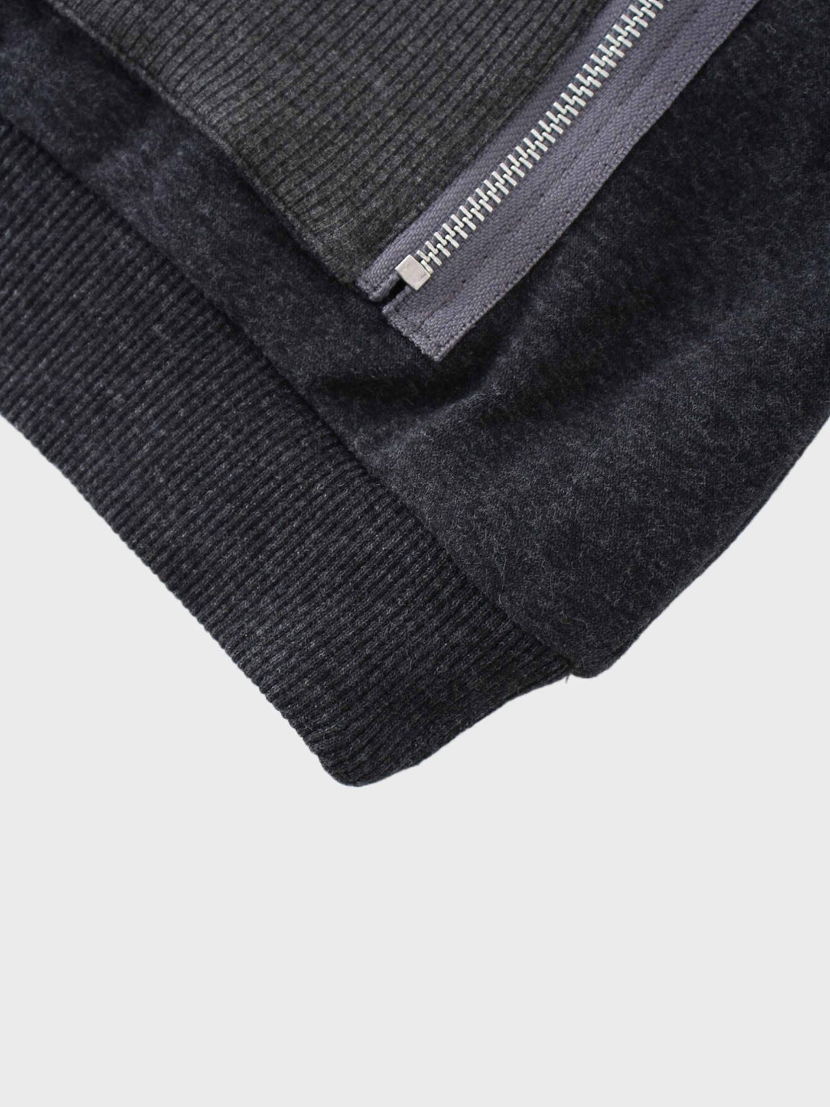 Hoodie detail, stylish zip feature.