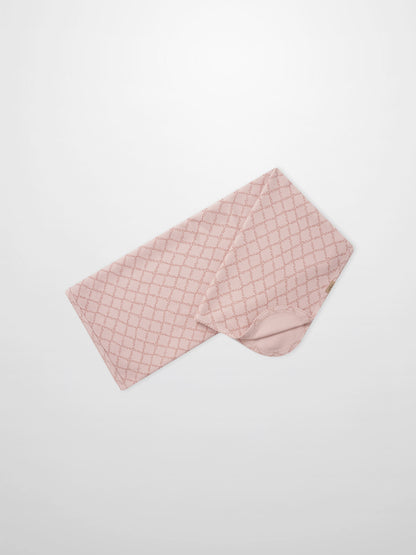 Pink Leaf Blanket swaddle by Adee, pink fabric with a lattice pattern.