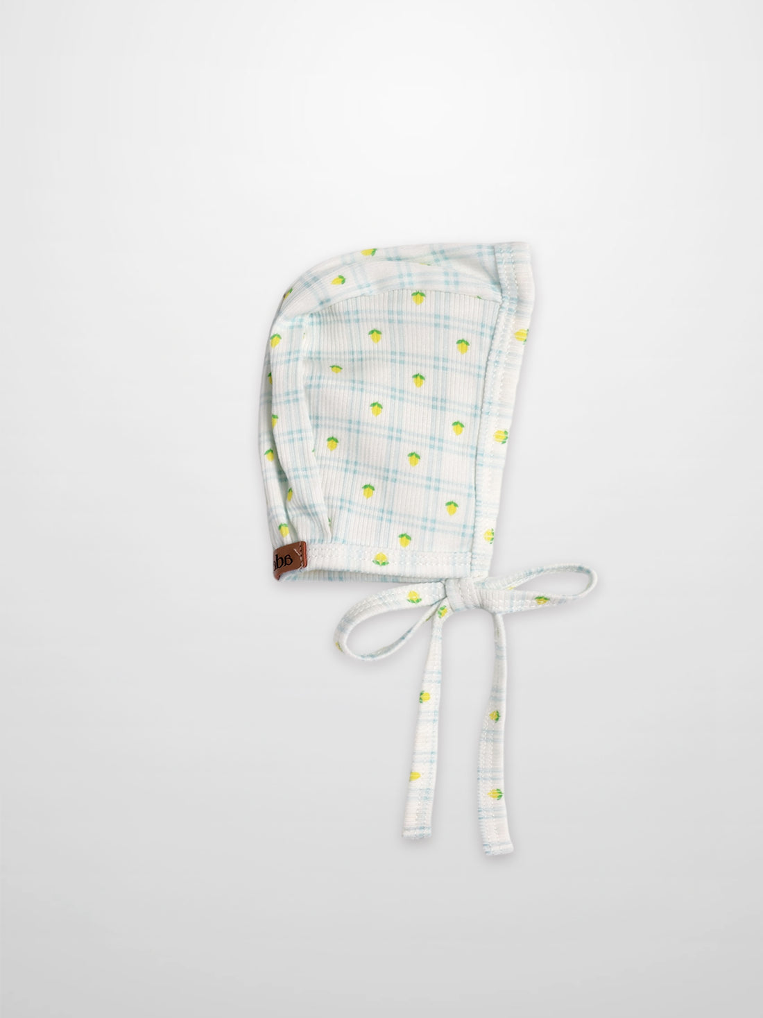 Lemon Window Bonnet for boys by Adee; light blue plaid with small lemon print and tie strings.