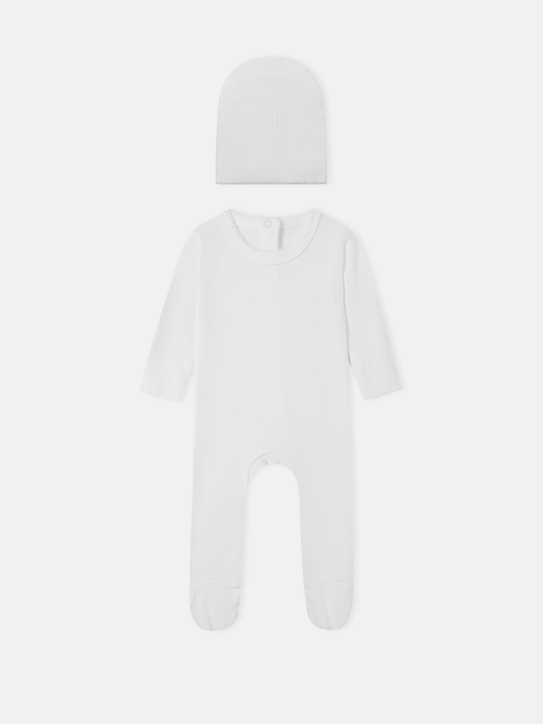 Legacy Stitch White layette set by Adee; 2-piece unisex white ribbed knit hat and footed romper.