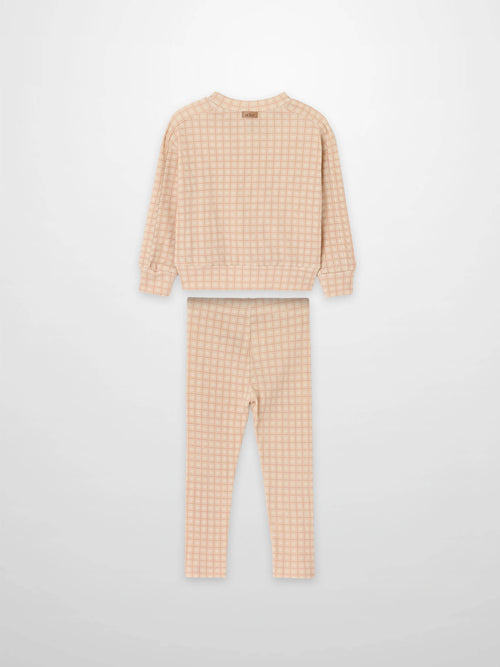 Pink Squared Girls Pajamas set by Adee, featuring a pink checkered long-sleeve top and matching pants.