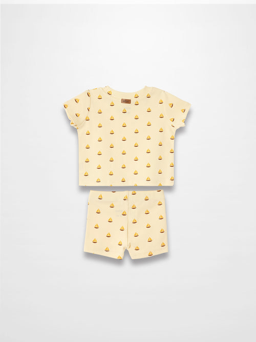 Adee Boat Print two-piece set for little boys with cream-yellow short-sleeve tee and matching shorts.