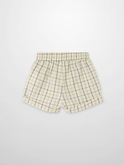 Beige plaid shorts with blue check pattern and elastic waistband
