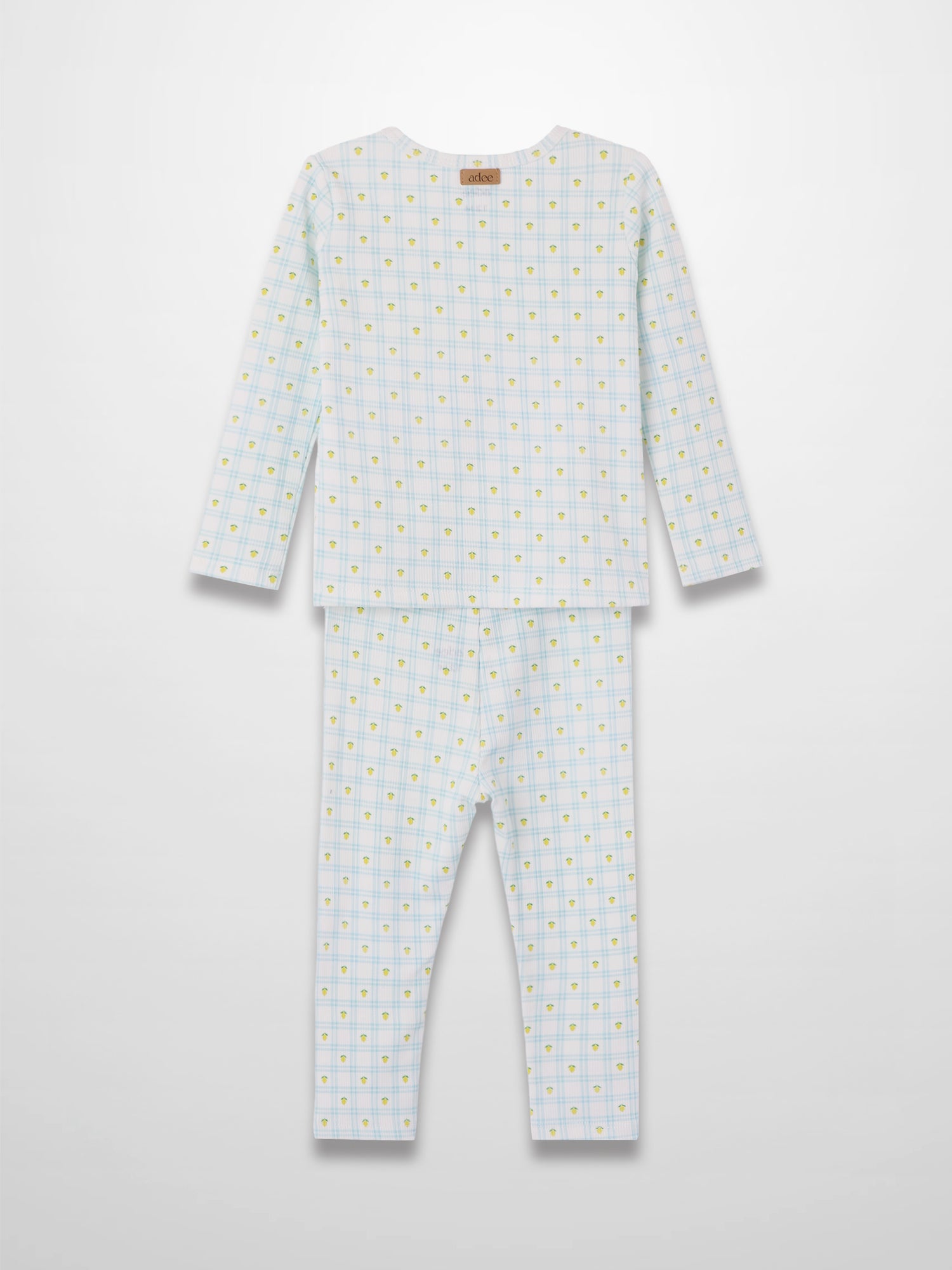 Lemon Window Pajamas: white base with light blue grid plaid and scattered yellow lemons, long-sleeve top and pants.