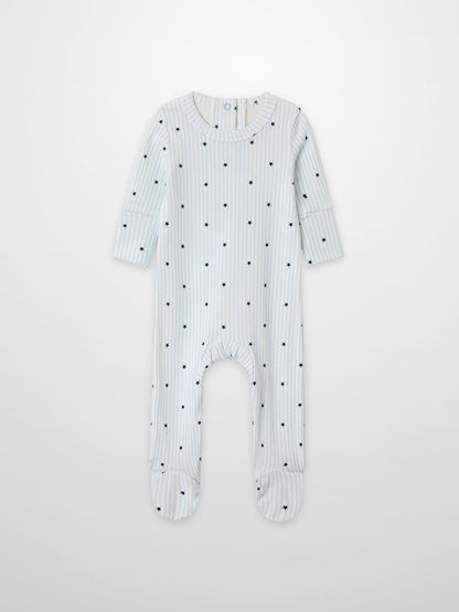 Blue Star Stretchy boys’ footed romper in light blue and white stripes with navy stars by Adee.