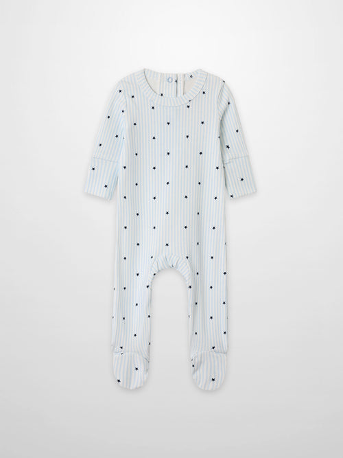 Blue Star Stretchy boys’ footed romper in light blue and white stripes with navy stars by Adee.