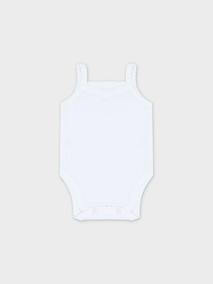 Soft white baby bodysuit with lace.