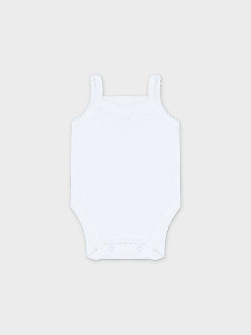 Soft white baby bodysuit with lace.