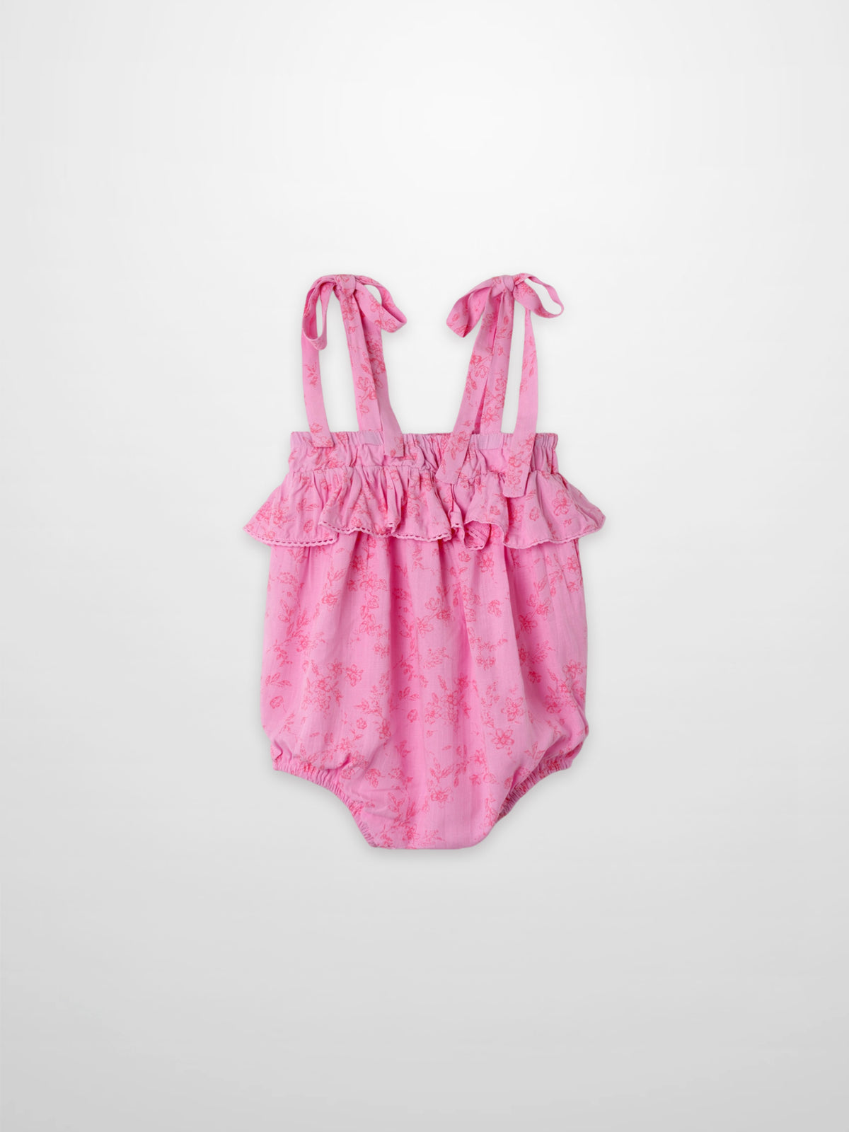 Pink floral girls romper dressy with ruffled top and tied straps