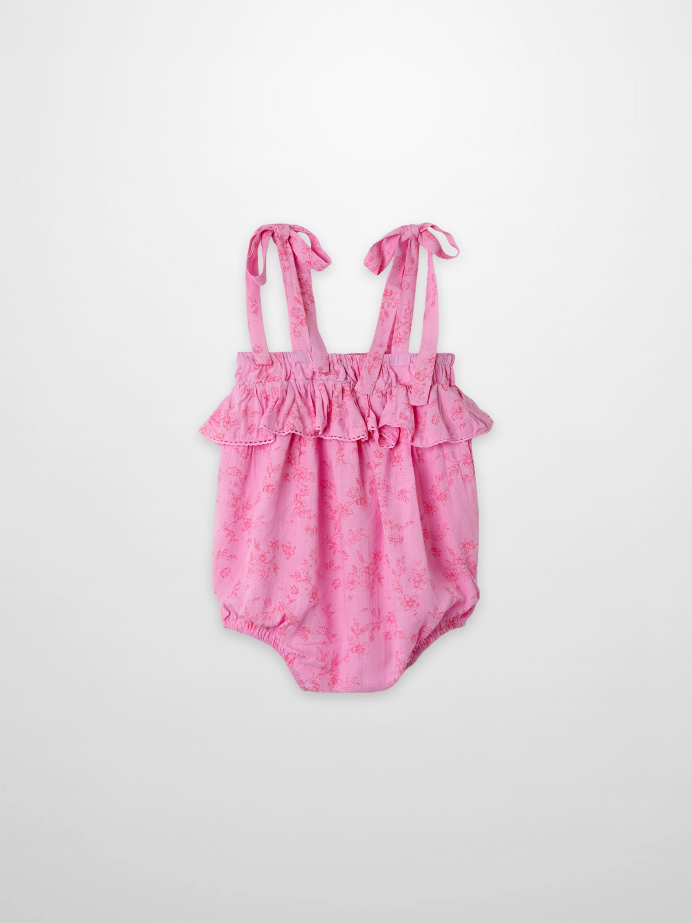 Pink floral girls romper dressy with ruffled top and tied straps